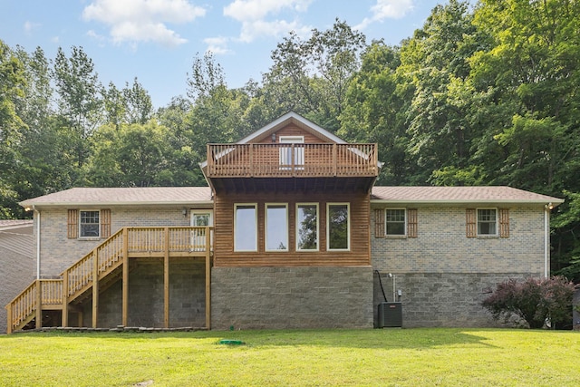 5141 Tranham Rd, Whites Creek, TN 37189 - rear view of property featuring a lawn, stairs, brick siding, and a balcony