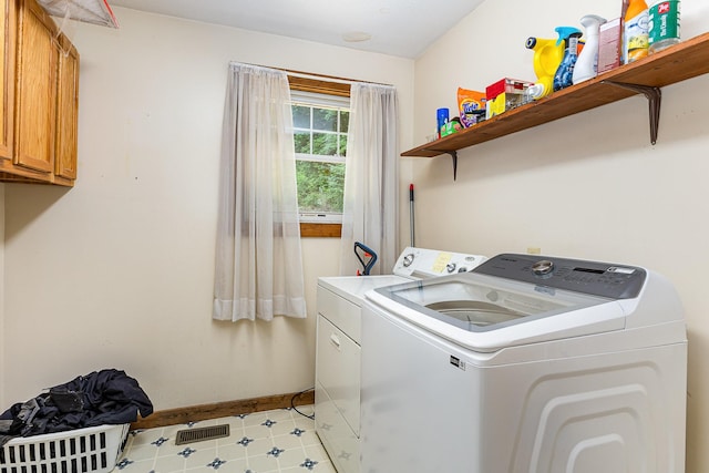 5141 Tranham Rd, Whites Creek, TN 37189 - laundry room with cabinet space, washer and clothes dryer, and light tile patterned floors