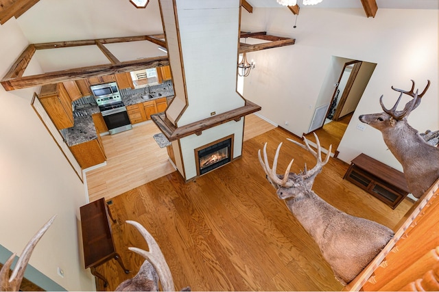 5141 Tranham Rd, Whites Creek, TN 37189 - living room featuring light wood finished floors and a glass covered fireplace