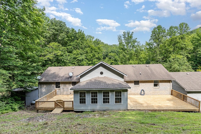 5141 Tranham Rd, Whites Creek, TN 37189 - back of house featuring a deck, a shingled roof, a view of trees, and a lawn