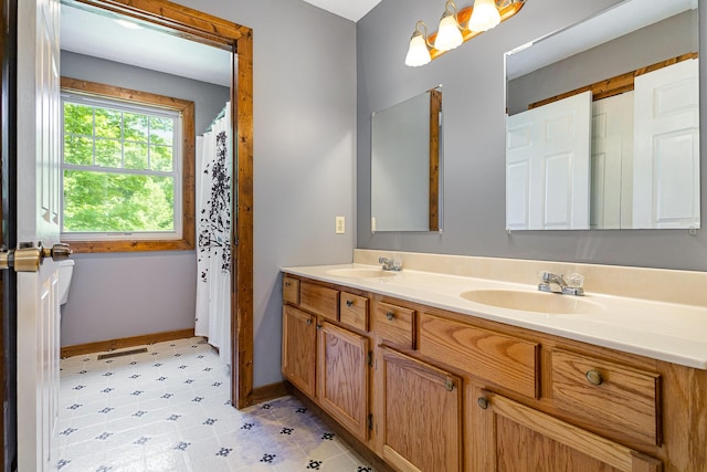 5141 Tranham Rd, Whites Creek, TN 37189 - bathroom featuring double vanity and baseboards