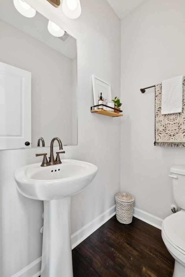 9007 Outpost Dr, Spring Hill, TN 37174 - half bathroom featuring toilet and wood finished floors