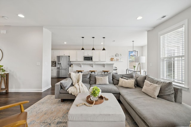9007 Outpost Dr, Spring Hill, TN 37174 - living area featuring dark wood finished floors and recessed lighting