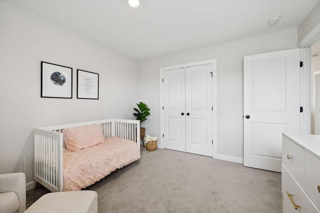 9007 Outpost Dr, Spring Hill, TN 37174 - bedroom with light carpet, a closet, and recessed lighting