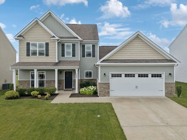 9007 Outpost Dr, Spring Hill, TN 37174 - craftsman house featuring brick siding, concrete driveway, a front yard, board and batten siding, and a shingled roof