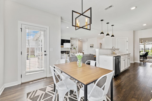 9007 Outpost Dr, Spring Hill, TN 37174 - dining area featuring a chandelier, dark wood-style flooring, and recessed lighting