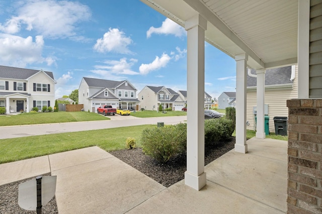 9007 Outpost Dr, Spring Hill, TN 37174 - porch featuring a residential view and a yard