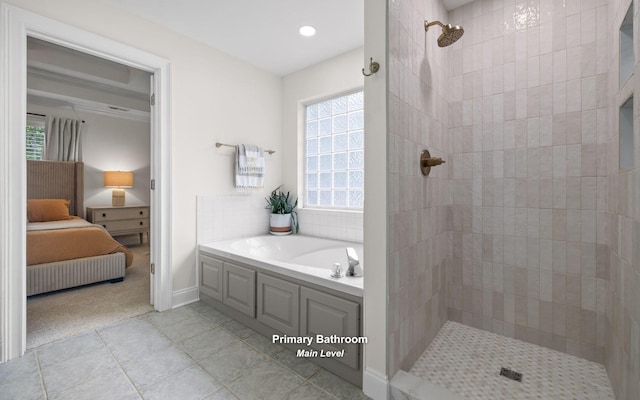 750 S Seminole Dr, Chattanooga, TN 37412 - ensuite bathroom featuring a garden tub, tiled shower, healthy amount of natural light, tile patterned floors, and recessed lighting