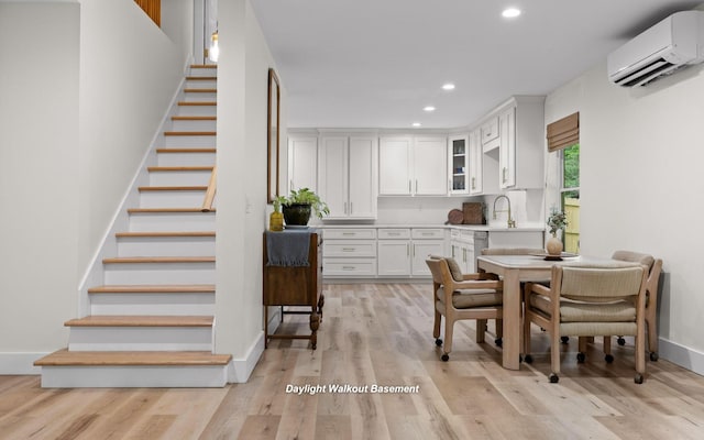 750 S Seminole Dr, Chattanooga, TN 37412 - dining space with a wall mounted AC, recessed lighting, stairs, and light wood-type flooring