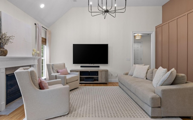 750 S Seminole Dr, Chattanooga, TN 37412 - living room featuring light wood-style flooring, a chandelier, high vaulted ceiling, and a high end fireplace