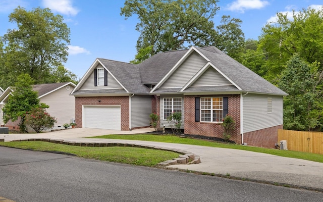 750 S Seminole Dr, Chattanooga, TN 37412 - traditional-style house with concrete driveway, brick siding, a shingled roof, and an attached garage
