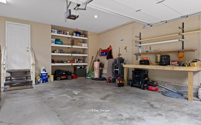 750 S Seminole Dr, Chattanooga, TN 37412 - garage with a garage door opener and a workshop area