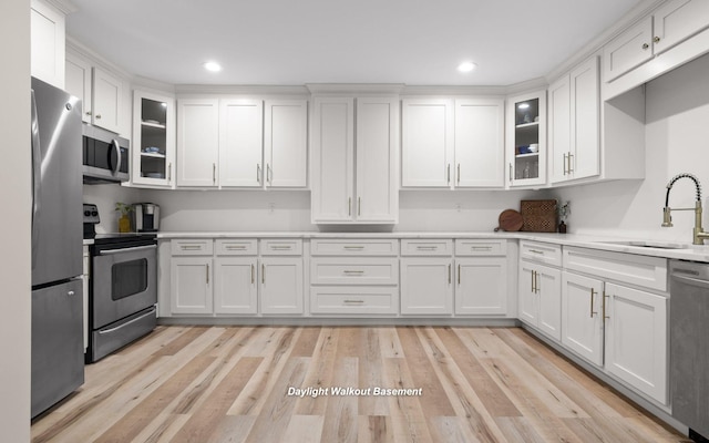 750 S Seminole Dr, Chattanooga, TN 37412 - kitchen with appliances with stainless steel finishes, white cabinets, light countertops, glass insert cabinets, and recessed lighting