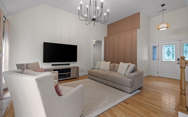750 S Seminole Dr, Chattanooga, TN 37412 - living room featuring a high ceiling, light wood-style floors, and a chandelier