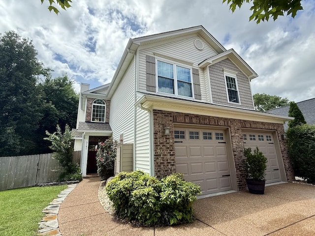 3141 Tristan Dr, Franklin, TN 37064 - traditional-style home with driveway, an attached garage, brick siding, and a chimney