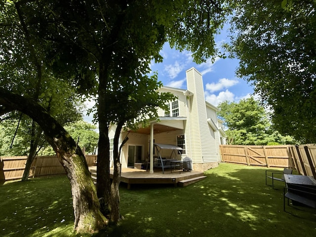 3141 Tristan Dr, Franklin, TN 37064 - rear view of house with a deck, a fenced backyard, and a chimney