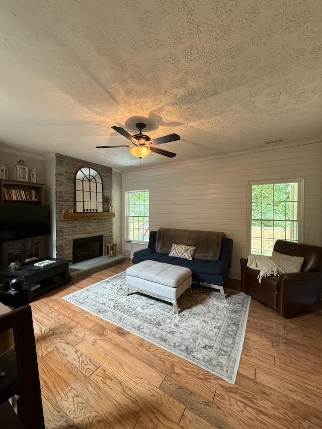 3141 Tristan Dr, Franklin, TN 37064 - living room with a textured ceiling, plenty of natural light, ceiling fan, hardwood / wood-style floors, and a fireplace