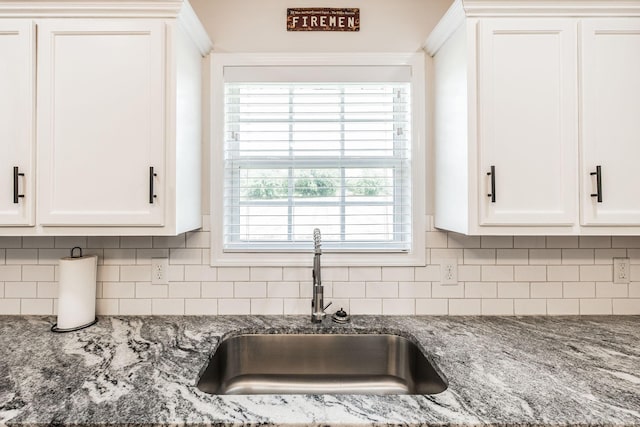 1004 Meridian Dr, Castalian Springs, TN 37031 - kitchen featuring white cabinetry, stone counters, and decorative backsplash