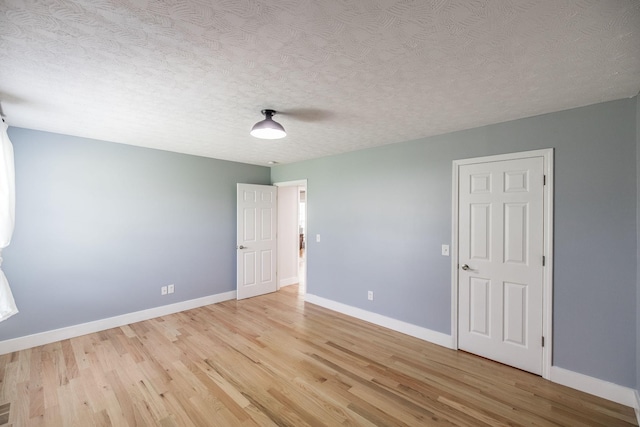 1004 Meridian Dr, Castalian Springs, TN 37031 - spare room featuring light wood-style floors and a textured ceiling