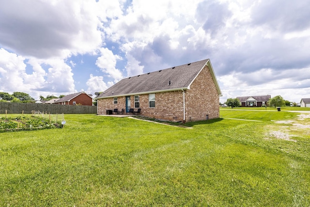 1004 Meridian Dr, Castalian Springs, TN 37031 - rear view of property featuring a patio area, brick siding, roof with shingles, and crawl space