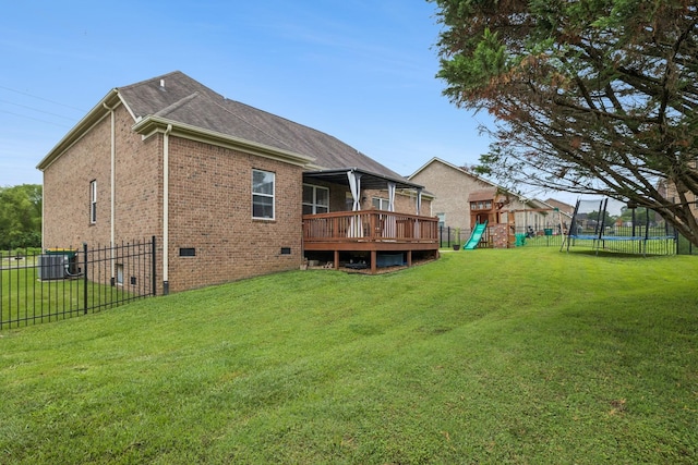 3022 Honeysuckle Dr, Spring Hill, TN 37174 - rear view of property with a playground, a trampoline, crawl space, a deck, and brick siding