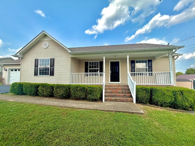 1802 Brittany Ct, Columbia, TN 38401 - view of front of property with covered porch, a front yard, an attached garage, and asphalt driveway
