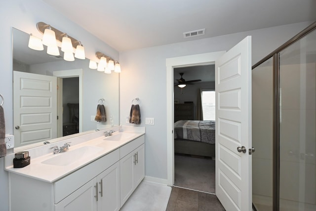 2004 Hardwick Ln, Gallatin, TN 37066 - full bathroom featuring connected bathroom, double vanity, tile patterned floors, a shower with shower door, and a ceiling fan