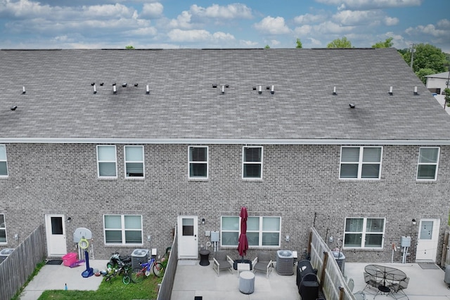 2004 Hardwick Ln, Gallatin, TN 37066 - rear view of property with a patio area, roof with shingles, a fenced backyard, and outdoor lounge area