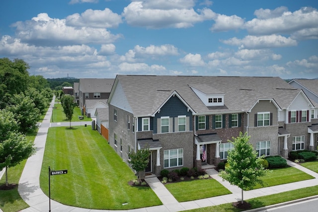 2004 Hardwick Ln, Gallatin, TN 37066 - multi unit property with a residential view, brick siding, a front yard, and roof with shingles