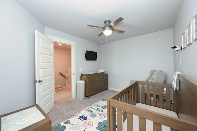 2004 Hardwick Ln, Gallatin, TN 37066 - bedroom with light colored carpet, a crib, and ceiling fan