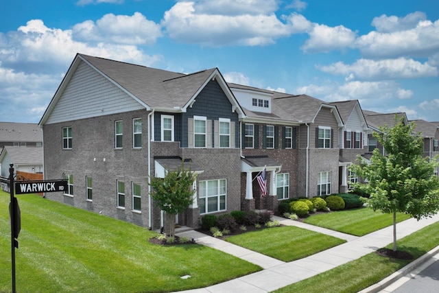 2004 Hardwick Ln, Gallatin, TN 37066 - view of front of house with brick siding, a front yard, and a residential view