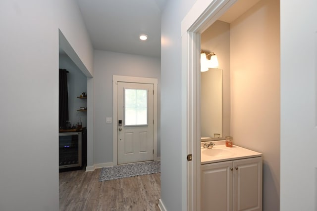 2004 Hardwick Ln, Gallatin, TN 37066 - entryway featuring wine cooler, wood finished floors, bar, and recessed lighting