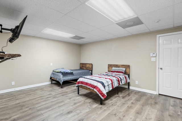 2276 Yeager Dr, Clarksville, TN 37040 - bedroom featuring light wood-style flooring and a paneled ceiling