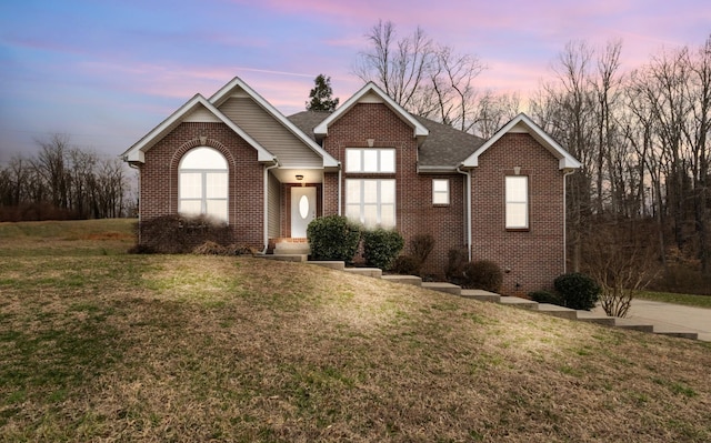2276 Yeager Dr, Clarksville, TN 37040 - view of front of home featuring brick siding, a yard, and roof with shingles