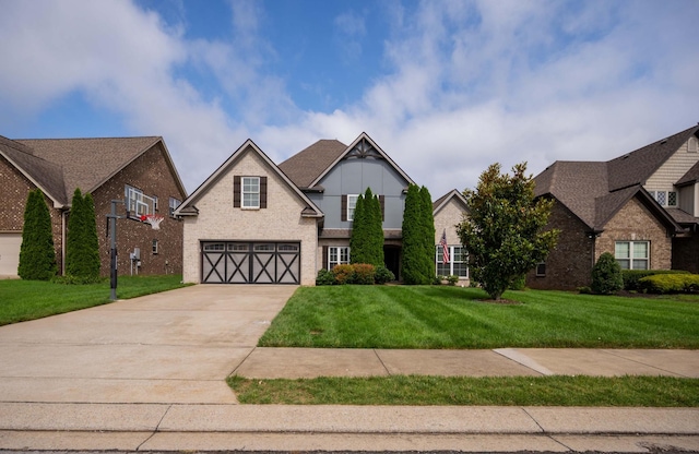 1241 Hensfield Dr, Murfreesboro, TN 37128 - view of front facade with a garage, a front lawn, concrete driveway, and brick siding