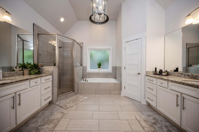 1241 Hensfield Dr, Murfreesboro, TN 37128 - full bathroom with two vanities, a shower stall, a garden tub, and high vaulted ceiling