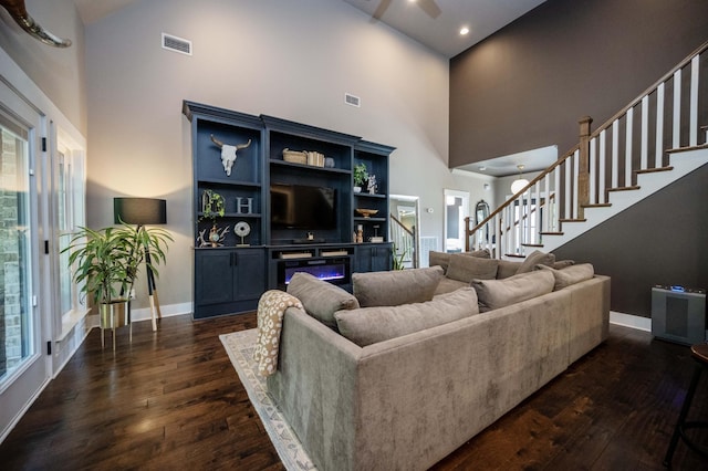 1241 Hensfield Dr, Murfreesboro, TN 37128 - living area featuring a high ceiling, dark wood-type flooring, and stairway