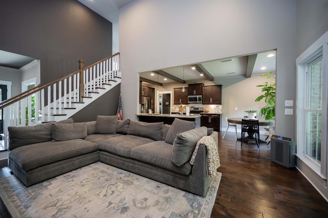 1241 Hensfield Dr, Murfreesboro, TN 37128 - living area featuring a towering ceiling, dark wood-style flooring, stairs, and recessed lighting