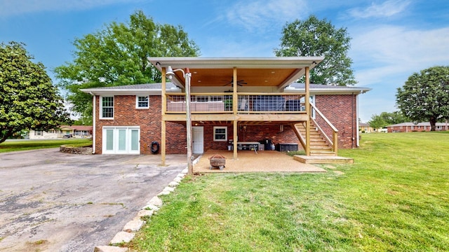 400 Westland Dr, Lebanon, TN 37087 - back of property with a patio area, ceiling fan, a yard, and brick siding