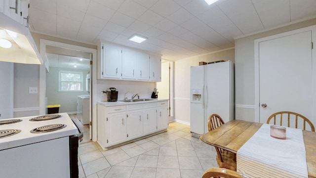400 Westland Dr, Lebanon, TN 37087 - kitchen with white appliances, under cabinet range hood, white cabinetry, light countertops, and light tile patterned floors
