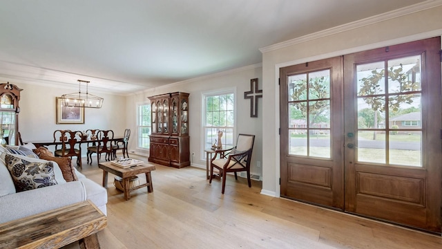 400 Westland Dr, Lebanon, TN 37087 - living room featuring light wood-type flooring, a chandelier, french doors, and crown molding