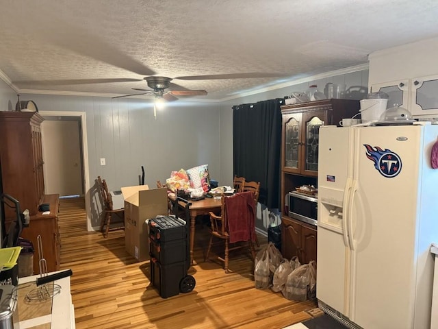 2503 Hickory Dr, Springfield, TN 37172 - dining space with light wood-type flooring, a ceiling fan, crown molding, and a textured ceiling