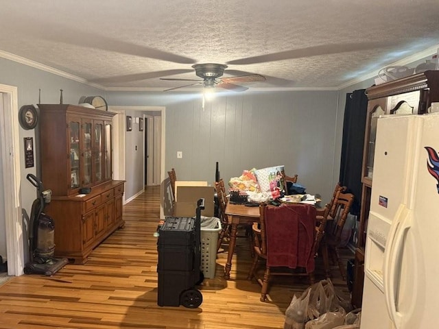 2503 Hickory Dr, Springfield, TN 37172 - dining space featuring light wood-type flooring, a ceiling fan, a textured ceiling, and ornamental molding