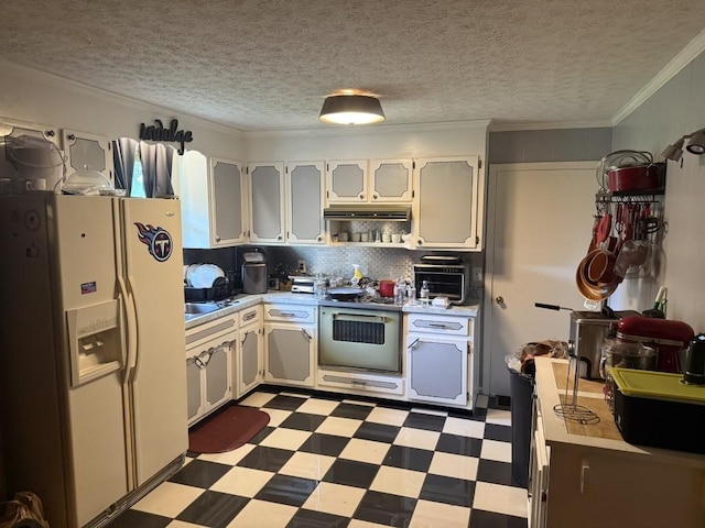 2503 Hickory Dr, Springfield, TN 37172 - kitchen featuring white refrigerator with ice dispenser, light flooring, light countertops, crown molding, and a textured ceiling