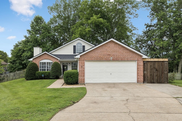 4012 Amber Way, Spring Hill, TN 37174 - view of front of house with brick siding, driveway, a garage, and a chimney