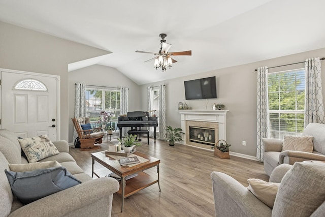 4012 Amber Way, Spring Hill, TN 37174 - living area with vaulted ceiling, ceiling fan, wood finished floors, and a fireplace