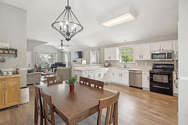 4012 Amber Way, Spring Hill, TN 37174 - dining area featuring a chandelier, light wood-type flooring, plenty of natural light, and vaulted ceiling