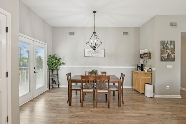 4012 Amber Way, Spring Hill, TN 37174 - dining room with wood finished floors, a chandelier, and french doors