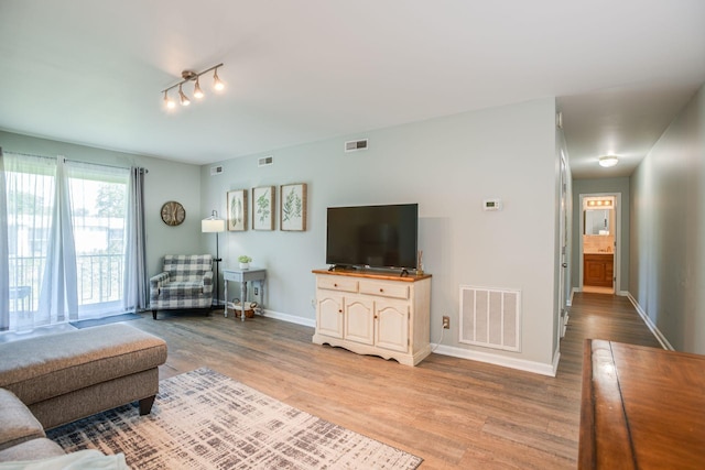 613 Hillsboro Rd Unit D27, Franklin, TN 37064 - living room with light wood-type flooring and track lighting