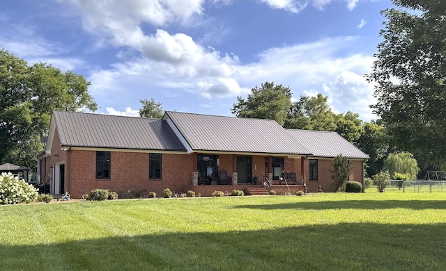 1904 Digg Ct, Columbia, TN 38401 - view of front of house featuring brick siding, covered porch, a metal roof, and an attached garage